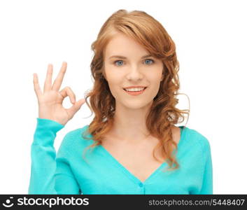 bright picture of teenage girl showing ok sign