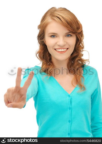 bright picture of teenage girl showing victory sign