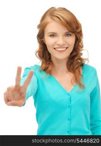 bright picture of teenage girl showing victory sign