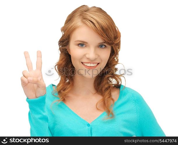 bright picture of teenage girl showing victory sign