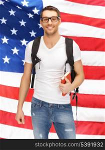 bright picture of travelling student with backpack and book over american flag