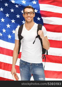 bright picture of travelling student with backpack and book over american flag