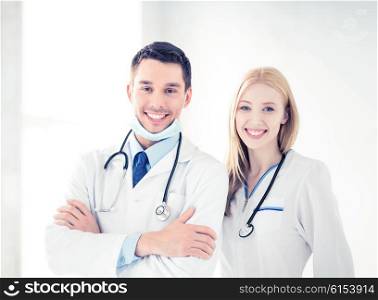 bright picture of two young attractive doctors. two young attractive doctors