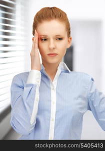 bright picture of unhappy woman in office