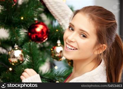 bright picture of woman decorating christmas tree.....