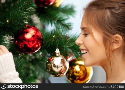 bright picture of woman decorating christmas tree