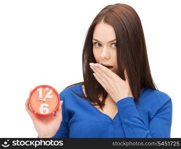 bright picture of woman holding alarm clock.