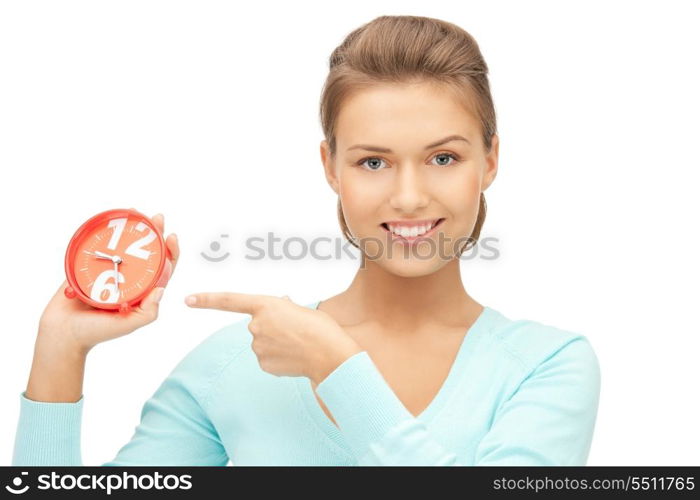 bright picture of woman holding alarm clock