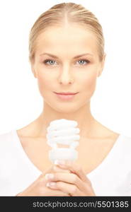 bright picture of woman holding energy saving bulb