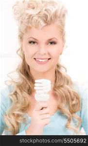 bright picture of woman holding energy saving bulb