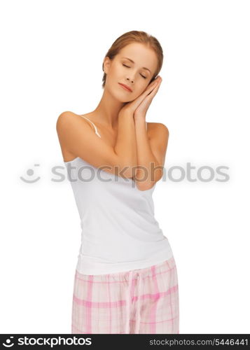 bright picture of woman in cotton pajamas with closed eyes