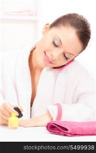 bright picture of woman polishing her nails