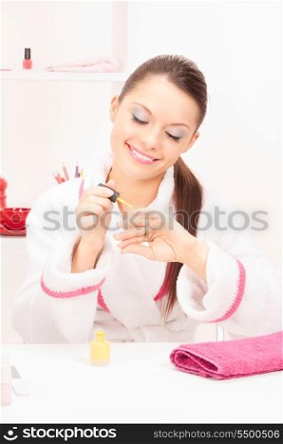 bright picture of woman polishing her nails