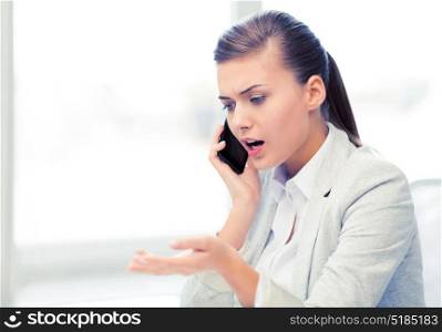 bright picture of woman shouting into smartphone. woman shouting into smartphone