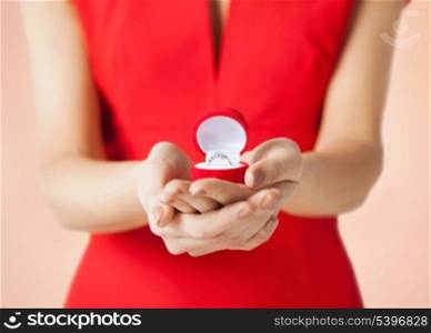 bright picture of woman showing wedding ring