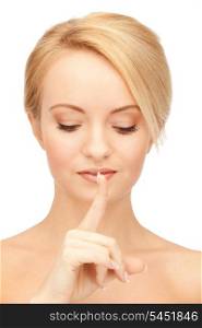 bright picture of woman with finger on lips....