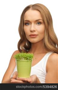 bright picture of woman with green grass in pot