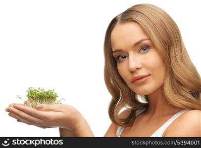 bright picture of woman with green grass on palms