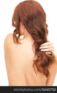 bright picture of woman with long hair from the back