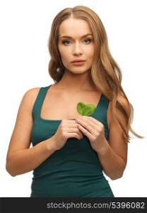 bright picture of woman with spinach leaves