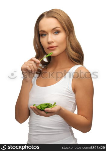 bright picture of woman with spinach leaves on palms