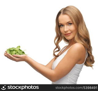 bright picture of woman with spinach leaves on palms