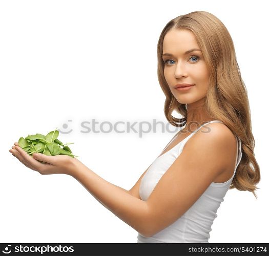 bright picture of woman with spinach leaves on palms
