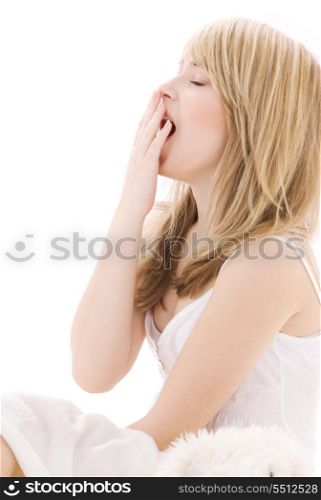 bright picture of yawning teenage girl in bed