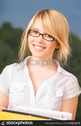 bright picture of young businesswoman in office