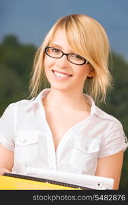 bright picture of young businesswoman in office