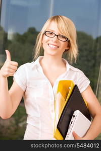 bright picture of young businesswoman in office