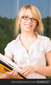 bright picture of young businesswoman in office