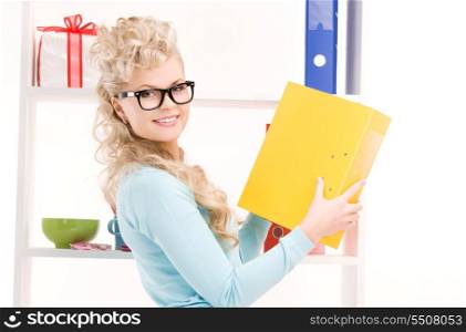 bright picture of young businesswoman in office