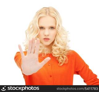 bright picture of young girl making stop gesture..