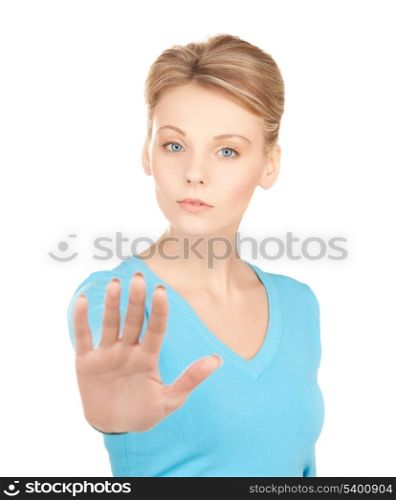 bright picture of young woman making stop gesture