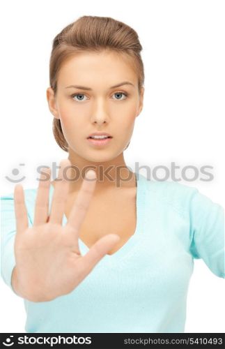 bright picture of young woman making stop gesture..