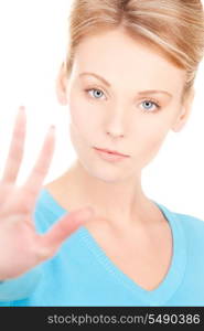 bright picture of young woman making stop gesture