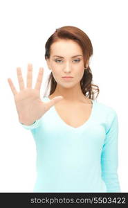 bright picture of young woman making stop gesture