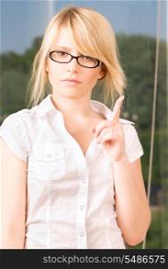 bright picture of young woman making warning gesture