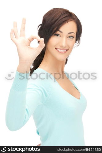 bright picture of young woman showing ok sign