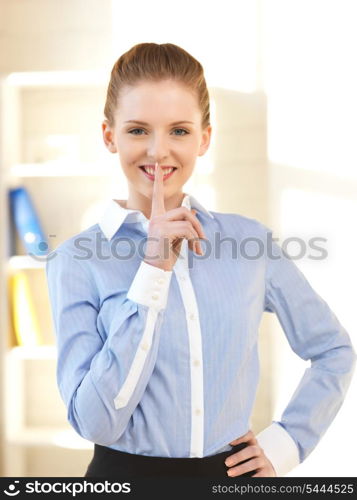 bright picture of young woman with finger on lips