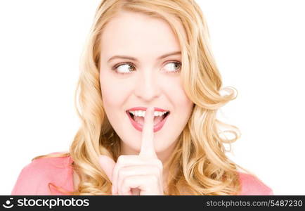 bright picture of young woman with finger on lips