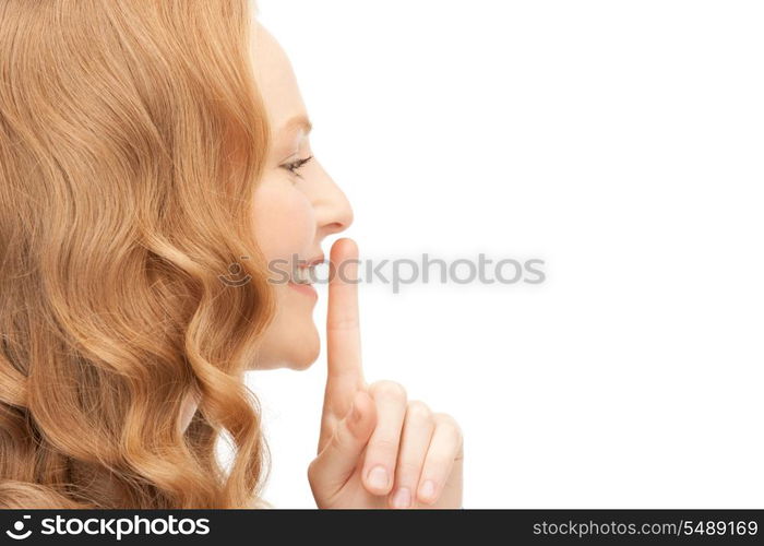 bright picture of young woman with finger on lips