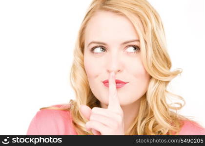 bright picture of young woman with finger on lips