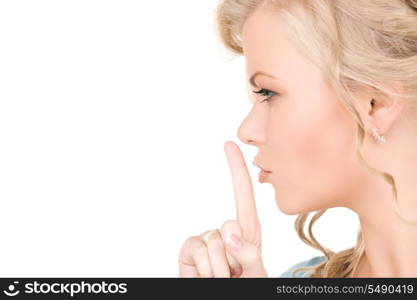 bright picture of young woman with finger on lips