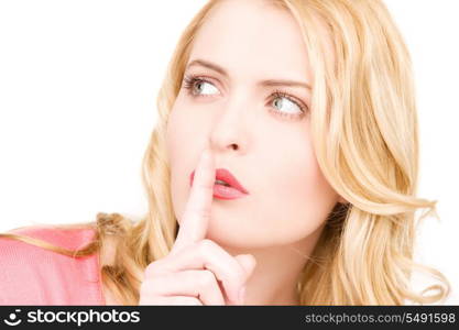 bright picture of young woman with finger on lips