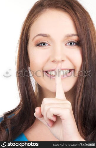 bright picture of young woman with finger on lips