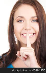 bright picture of young woman with finger on lips