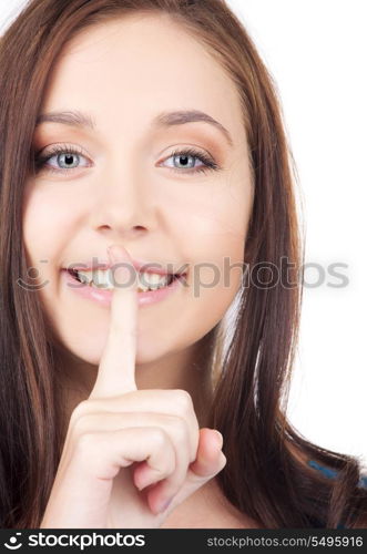 bright picture of young woman with finger on lips