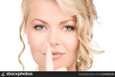 bright picture of young woman with finger on lips